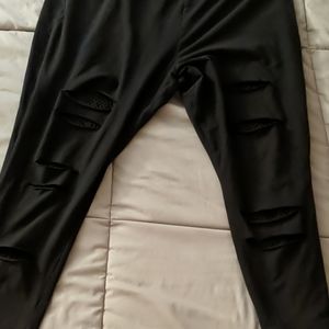 Torrid size 5 black leggings with rips and fishnet